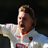 Henry Thornton celebrates a wicket during Victoria’s collapse on the final day of the Sheffield Shield final.