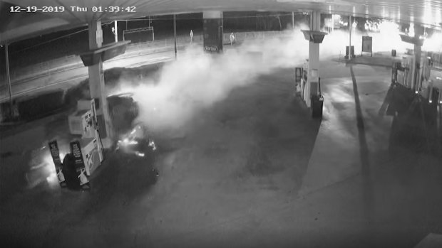 A still-image from the service station CCTV footage as the car destroys the fuel bowser.