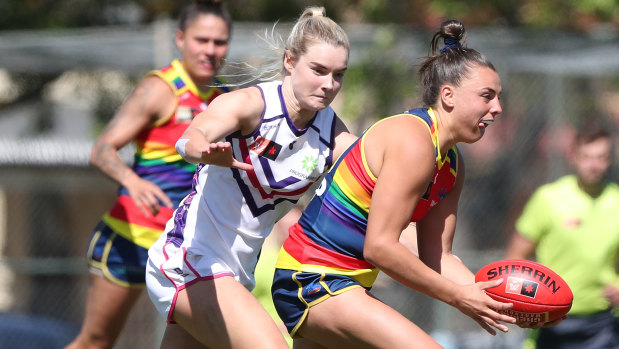 Ebony Marinoff of the Crows and Hayley Miller of the Dockers in action.
