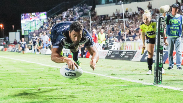 Airborne: Justin O'Neill of the Cowboys gets horizontal for a score against the Knights in Townsville.