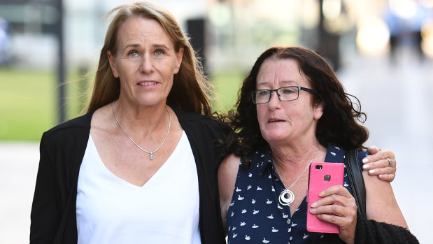 Pamela McLaren (right) and Pauline Sidon, sisters of manslaughter victim Linda Sidon, leave the Supreme Court in Brisbane on Monday.