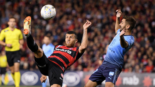 Zullo tussles with Jaushua Sotirio of the Wanderers in Sydney's FFA Cup win.