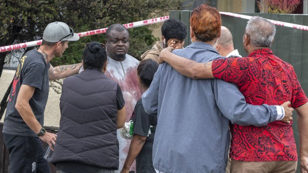 A survivor from the shooting comes through a cordoned off area.