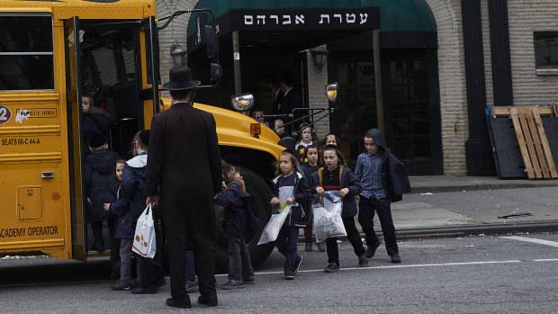Children from a Jewish school in Williamsburg, Brooklyn, board a school bus in April. 