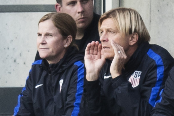 Tony Gustavsson in the dugout with USA coach Jill Ellis.