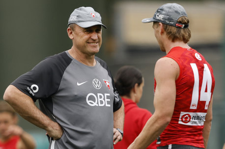 Tough calls: Swans coach John Longmire and Callum Mills.