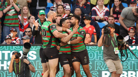 The Rabbitohs celebrate one of Alex Johnston’s two tries at Allianz Stadium.
