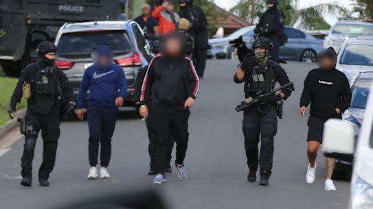 The arrests were made on Friday, where they allegedly found weapons, drugs and cash. 