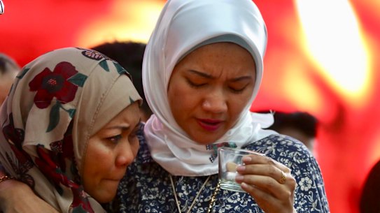 Norazlinda Ayub, left, and Intan Maizura Othaman, wife of an air crew member of MH370 at the Day of Remembrance event in Kuala Lumpur.