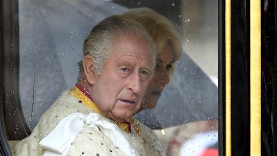 A lip reader says Charles grumbled to Camilla after his carriage arrived early.