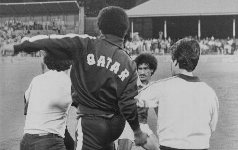 Qatar players and officials clash with some of the spectators who ran on to the SCG and attacked them last night.
