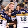 Brumbies players celebrate a winning try by Charlie Cale against the Blues.