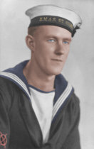 A colourised studio portrait of Able Seaman Thomas Welsby Clark when he was an Ordinary Seaman on HMAS St Giles. 