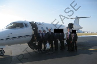 The Ipswich contingent next to  their chartered private jet in Geneva, Switzerland. The photograph was released under Right to Information laws.