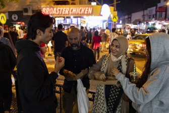 Ahsanullah Ahsan with his wife Farhana, daughter Farheen and son Adib. They come every year to experience a late-night street bazaar that reminds them of Asia,