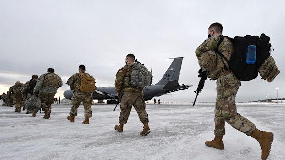 Airmen and soldiers from the Alaska National Guard prepare to depart from Joint Base Elmendorf-Richardson on Sunday to assist with Joe Biden's inauguration.