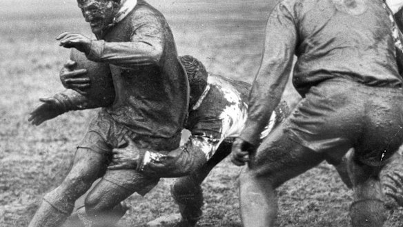 Summons is tackled by St George half George Evans in the 1963 grand final.