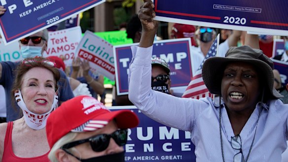 Trump supporters rally against a law signed by Nevada Governor Steve Sisolak to mail ballots to all of the state's active voters ahead of the November election.