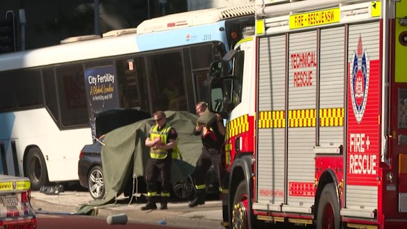 BMW driver charged after woman dies in crash between car and bus
