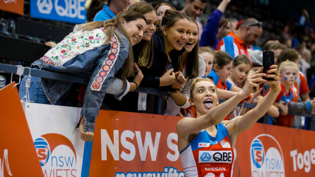 Spreading the word: Helen Housby meets the fans after the round two win over the Thunderbirds.