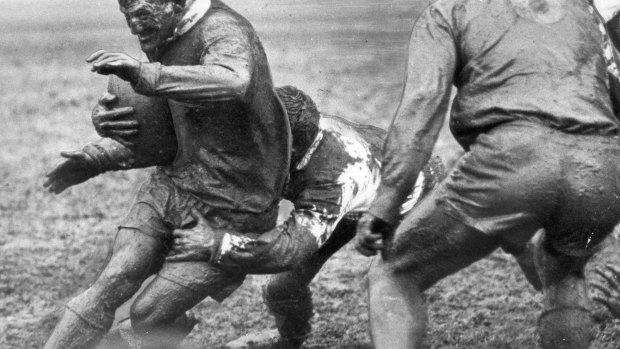 Summons is tackled by St George half George Evans in the 1963 grand final.