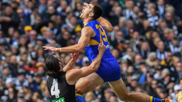 Scott Lycett flys high on Saturday. The big Eagle is being chased by Port Adelaide.