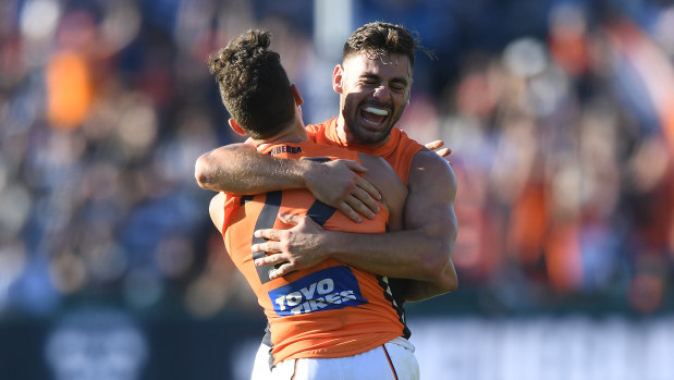 Brothers in arms: Stephen Coniglio (right) embraces Josh Kelly after GWS rolled Geelong in one of their most important victories as a club. 