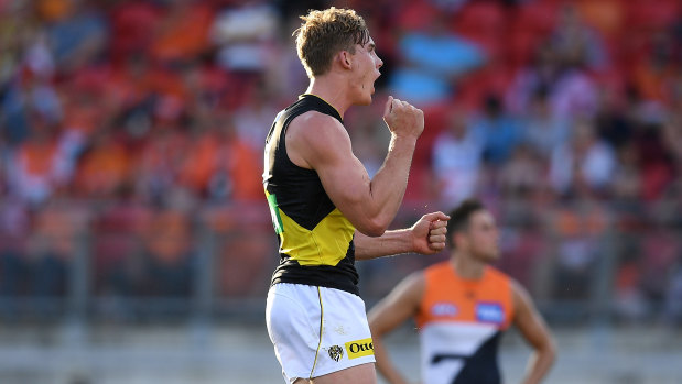 Up and about: Tom Lynch puts one through the big sticks for Richmond during their round 3 loss to GWS.