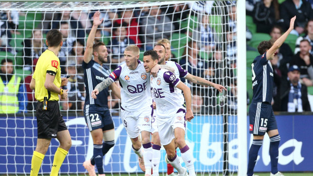 Glory game: Victory players protest after Joel Chinese puts Perth 1-0 up.