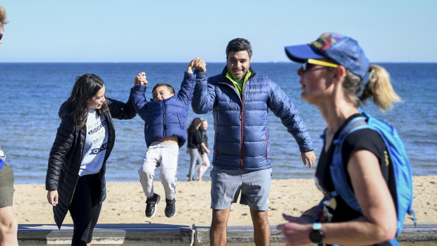 Colombian family Daniel and Alexandra Gil with their 4 year old son Samuel were cautiously out and about in St Kilda on a stunning Autumn Day