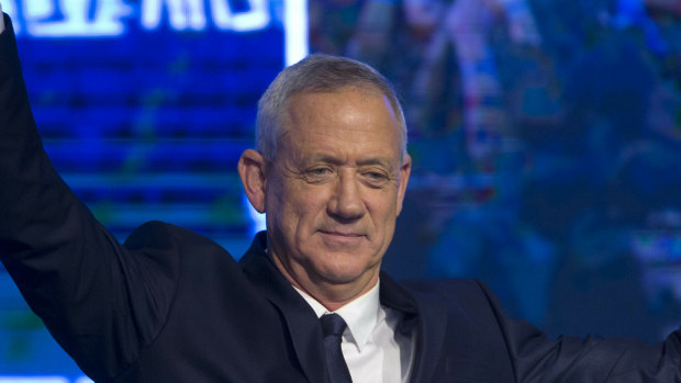 Blue and White party leader Benny Gantz salutes on Tuesday night.
