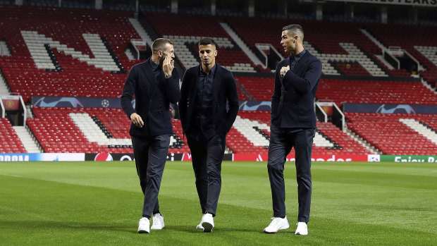 Familiar ground: Ronaldo (right) takes a look around Old Trafford.