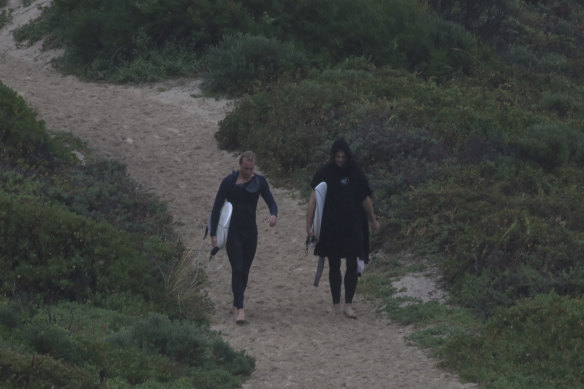Dockers captain Nat Fyfe. right, spotted going for a surf on Thursday.
