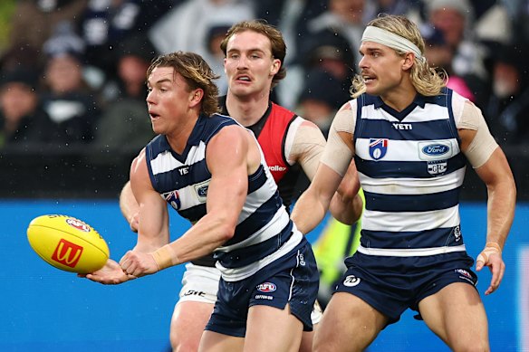 Tanner Bruhn of the Cats handballs.