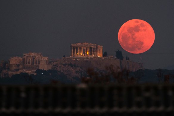 A super blood moon rises behind the 2500-year-old Parthenon temple on the Acropolis of Athens, Greece, in January 2018.