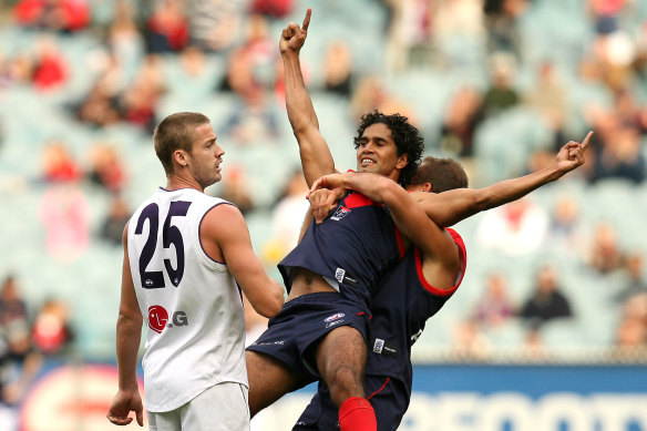 Aaron Davey and Brad Green celebrate a goal in the Demons’ come-from-behind win against the Dockers at the MCG in 2008.