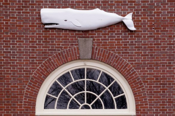 The likeness of a whale sits above the entrance to the New Bedford Whaling Museum.