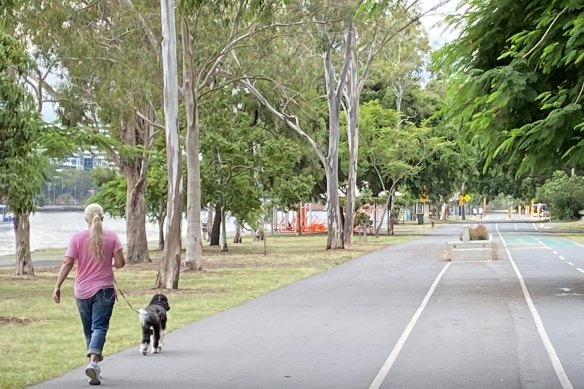 The South Brisbane walkway with old factories on the right hand side and the Brisbane River the left hand side.