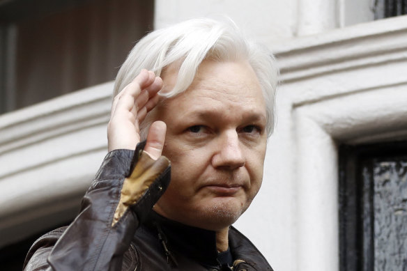 WikiLeaks founder Julian Assange greets supporters from a balcony of the Ecuadorian embassy in London back in 2017.