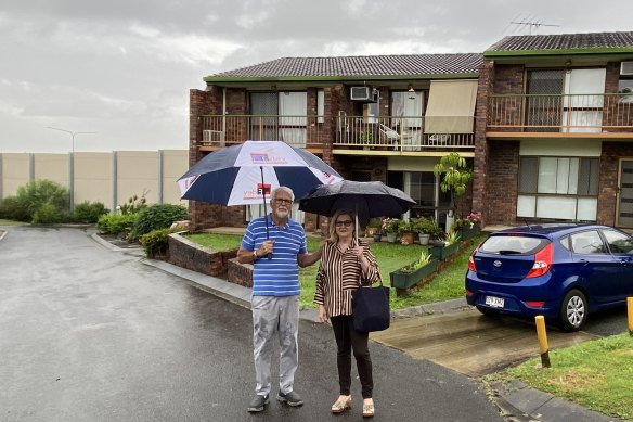 Self-funded retirees Julia and Anthony Mayfield outside their  depreciating two-storey unit beside the M1 at Rochedale South.