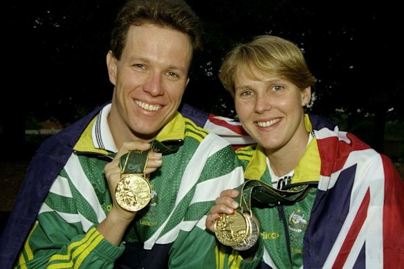 Kieren Perkins and Susie O’Neill show off their gold medals from the Atlanta 1996 Olympics.