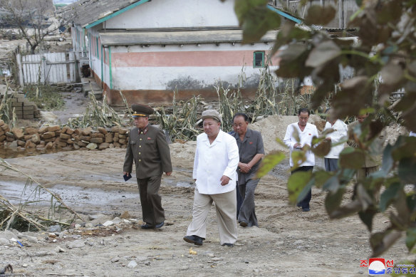In this photo provided by the North Korean government, North Korea leader Kim Jong-un visits a typhoon-damaged area in the South Hamgyong province, North Korea.