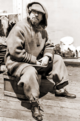 Hubert Wilkins takes a break wharfside at Deception Island circa 1928.