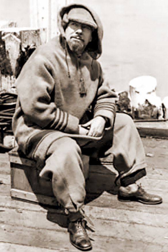 Hubert Wilkins takes a break wharfside at Deception Island circa 1928.