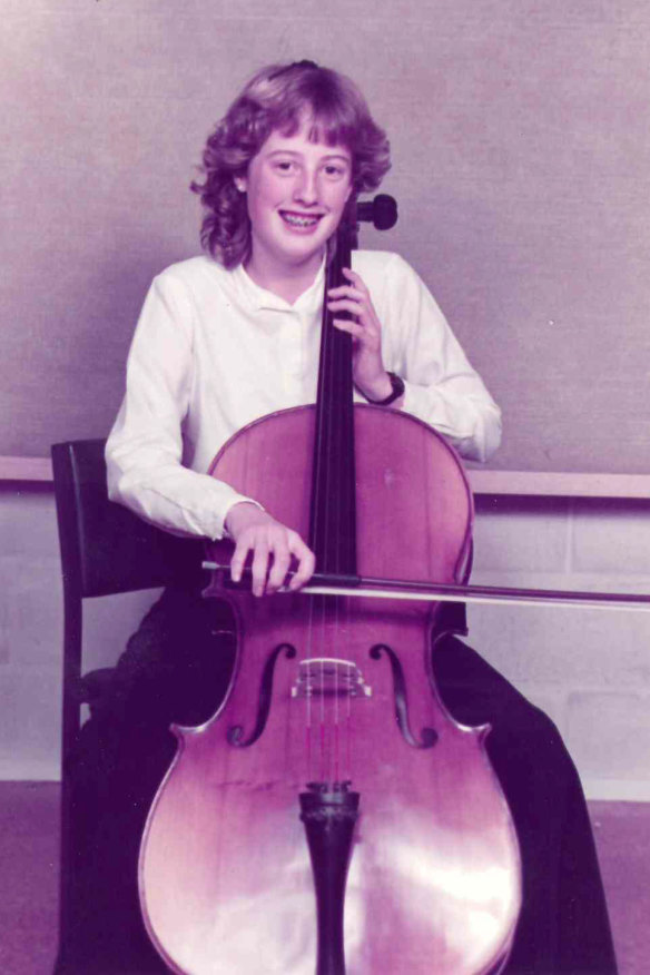 Playing her beloved cello, which now sits untouched in her home office.