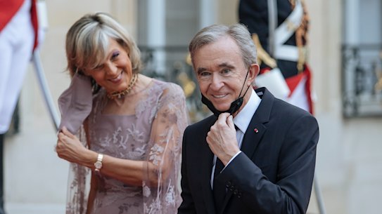LVMH chief Bernard Arnault, with wife Helene, is the world’s richest person.