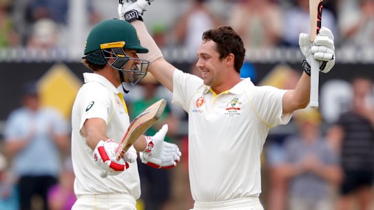 Australia's Travis Head (right) celebrates with teammate Joe Burns after reaching his century.