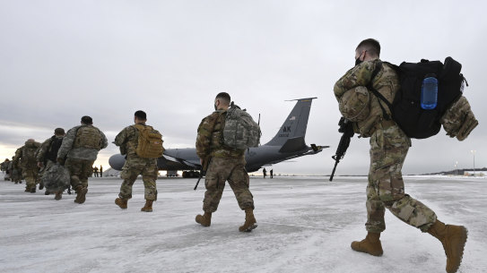 Airmen and soldiers from the Alaska National Guard prepare to depart from Joint Base Elmendorf-Richardson on Sunday to assist with Joe Biden's inauguration.