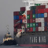 Ship that lost 83 shipping containers docks as clean-up continues