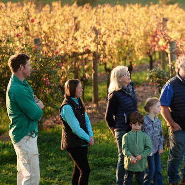 Winemaker Nick Farr, far left, with family and friends in the vineyard.